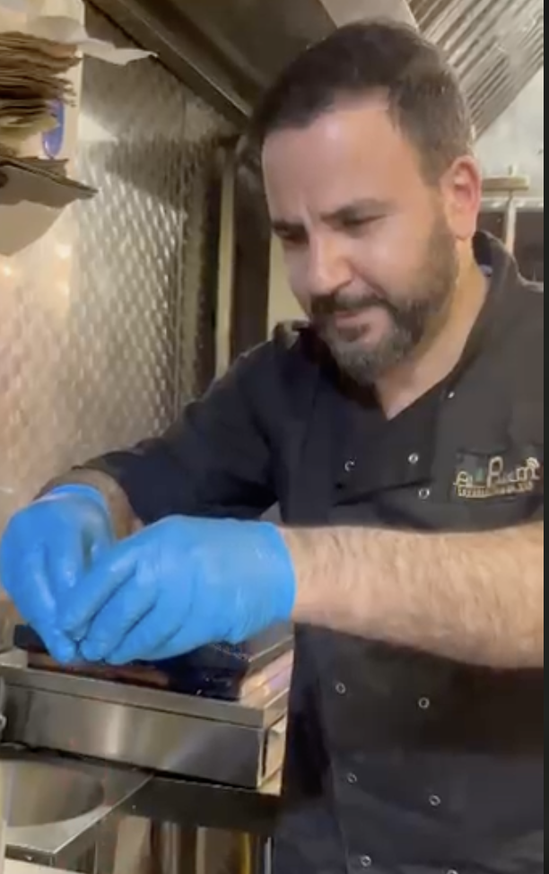 Chef Mo preparing Lebanese food in the kitchen at Al Reem Cuisine